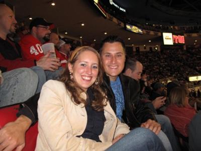 My boyfriend and I at a Blackhawks hockey Game BEFORE His Jersey