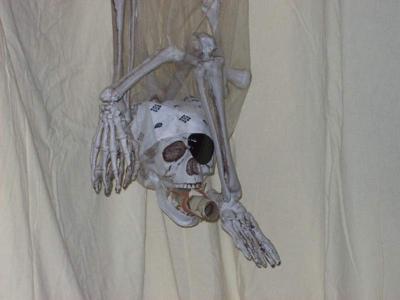 Our Halloween-turned birthday decoration.  In his mouth is the final treasure map that led to the piñata! 